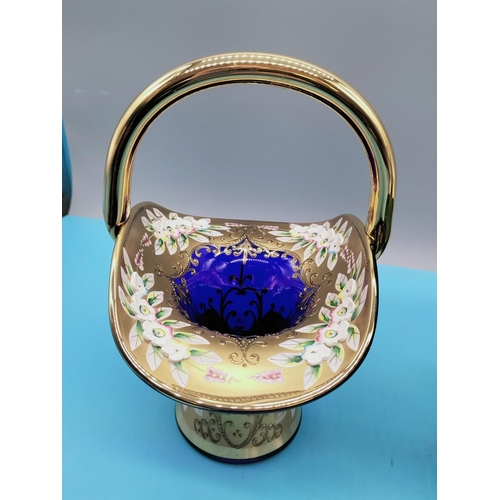 87 - Coloured Glass Baskets (2) with Gold and Enamelled Flowers. 23cm High, 16cm x 14cm.