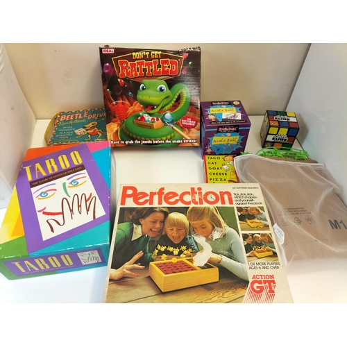 271 - 2 Boxes of Unchecked Board Games to include Taboo and Perfection, Rubiks Cube, Car Track, etc.