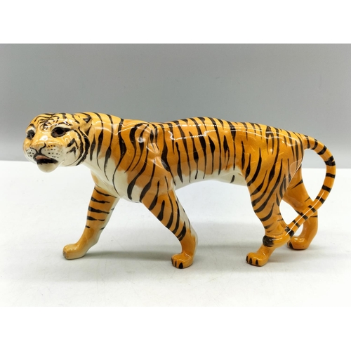 112 - Beswick Figure of a Tiger. 22cm x 11.5cm.