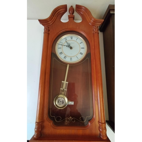 349 - Wooden Case Wall Clocks (2). 1 Battery and 1 Wind Up. 72cm x 29cm x 13cm. This Lot is Collection Onl... 