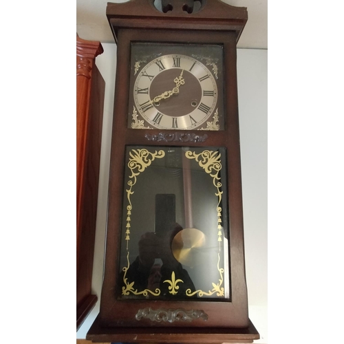 349 - Wooden Case Wall Clocks (2). 1 Battery and 1 Wind Up. 72cm x 29cm x 13cm. This Lot is Collection Onl... 