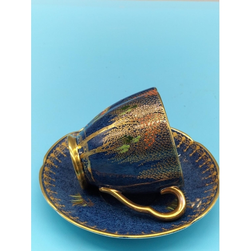 489 - 1940s Blue Carlton Ware Cup and Saucer in the 'New Stork' Pattern.