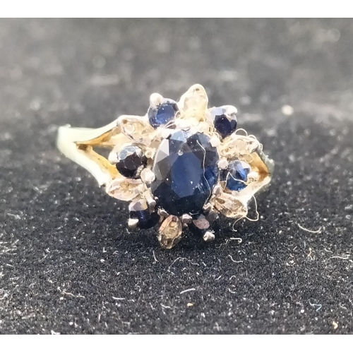 500 - Gold on Silver Ring set with Sapphires and Clear Stones. 2 Stones Missing.