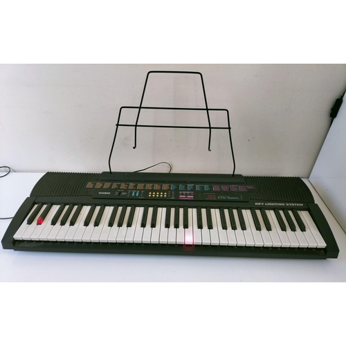 523 - Casio CTK-520L Key Lighting System Keyboard with Stand. W/O. This Lot is Collection Only.