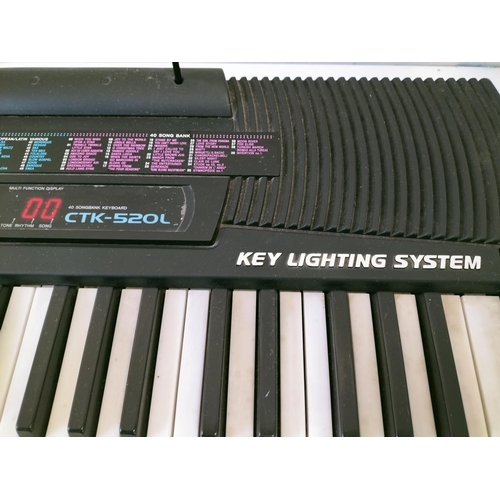 523 - Casio CTK-520L Key Lighting System Keyboard with Stand. W/O. This Lot is Collection Only.