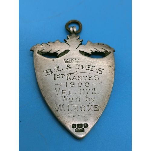 57 - Silver Hallmarked Shield Medal. To Reverse 'B.L & D.H.S 1st Nantes 1900 Vel 1172 Won by W Cooke'.