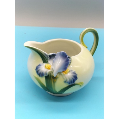 629 - Graff Porcelain Iris Lidded Sugar Pot and Cream Jug. Tallest being 14cm.