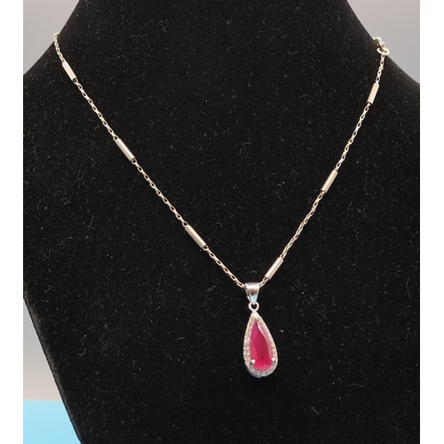 676 - Silver 925 Tear Drop Pendant set with Red and Clear Stones on a White Metal Chain.