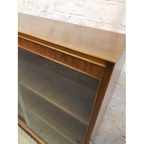 537 - Wooden 3 Shelf Bookcase with Sliding Glass Doors. 92cm High, 91.5cm x 24.5cm. This Lot is Collection... 