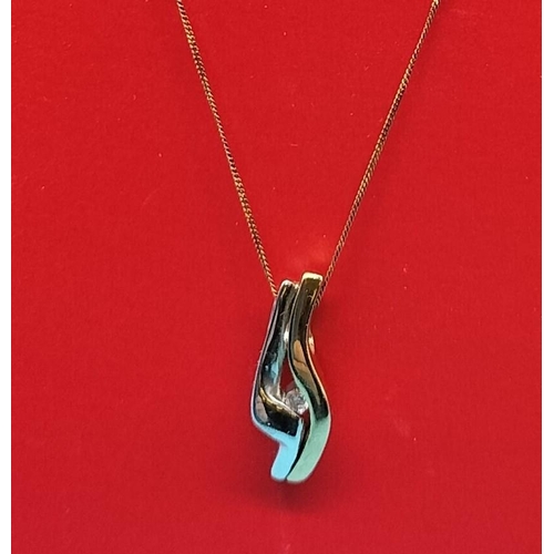 131 - 9ct Gold and Diamond Earrings and Pendant Set. 5 Grams.