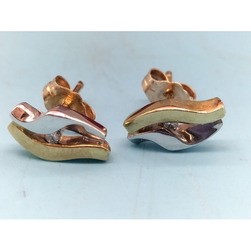 131 - 9ct Gold and Diamond Earrings and Pendant Set. 5 Grams.