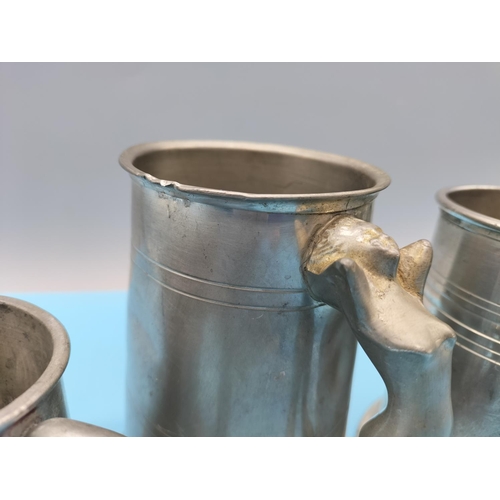 132 - Graduated Pewter Tankards (3).