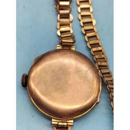 338 - 9ct Cased Rolex Movement Watch with Gold Tone Strap. A/F  Glass and Requires Second Finger.