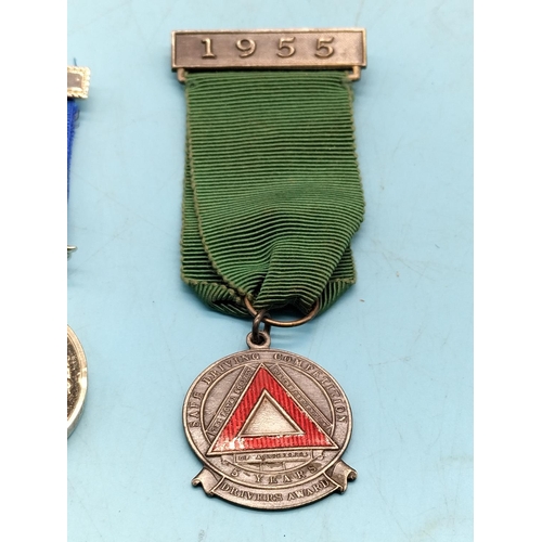 255 - Medals (2) - Safe Driving (Fattorini and Sons, Birmingham) and International Submarine Service.