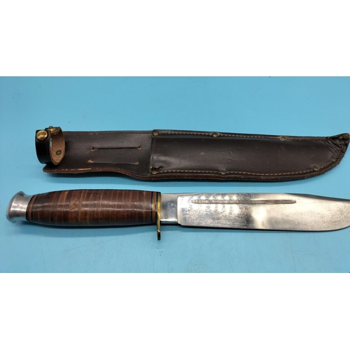 127 - Vintage Bowie Knife in Leather Sheath. 33cm Long.