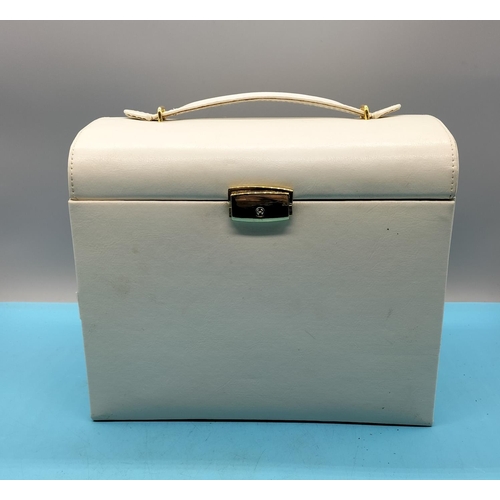 382 - Ivory Faux Leather Make Up case. 22cm High. All proceeds from this Lot to the Ukraine Fund.