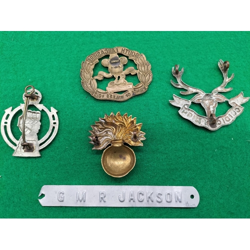706 - Collection of 4 Cap Badges.