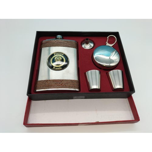 128 - Boxed Hip Flask Set to include Flask, 2 x Measuring Cups, Stand and Drinking Goblet.