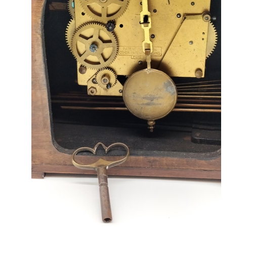21 - 1930's Oak Cased Mantle Clock with Westminster Chimes. W/O. 21cm High, 34cm x 13cm.