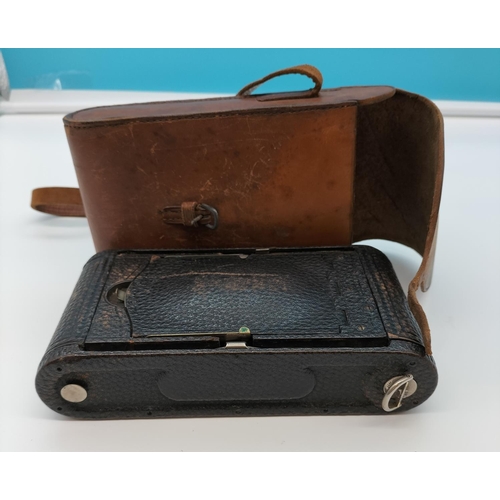 25 - Eastman Kodak Pocket Camera with Maroon Coloured Bellows and Brass Front. Cased.