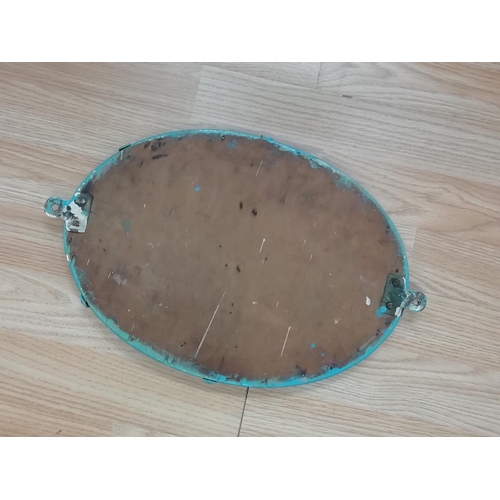 694 - Vintage Oval Shaped Wall Mounted Mirror with Wooden Base. 36cm x 26cm.