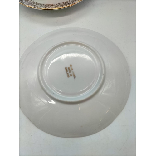103 - English Bone China Cups and Saucers (4) in a Village Scenes Pattern.