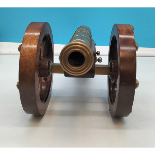 1 - Wooden Framed Brass Cannon. 57cm Long, 22cm High.