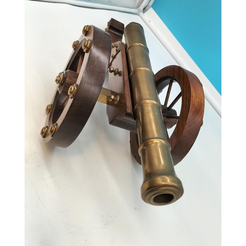 1 - Wooden Framed Brass Cannon. 57cm Long, 22cm High.