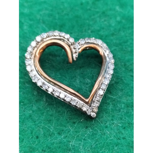 14 - 9ct Gold and Silver Heart Pendant set with 0.25ct of Diamonds.