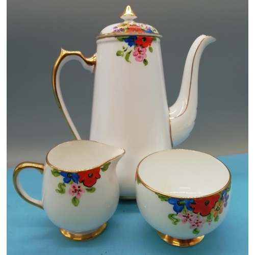 279 - Hand Painted 11 Piece Part Coffee Set with a Floral Pattern.