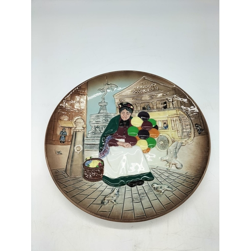 320 - Royal Doulton 25cm Wall Plate 'Old Balloon Seller' D6649. Seconds Quality.