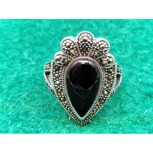 53 - 925 Silver Ring set with Onyx and Marcasite. Size P.