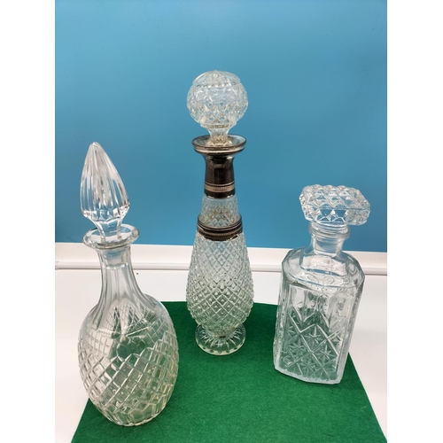 106 - Glass Decanters (3). Tallest being 38cm.