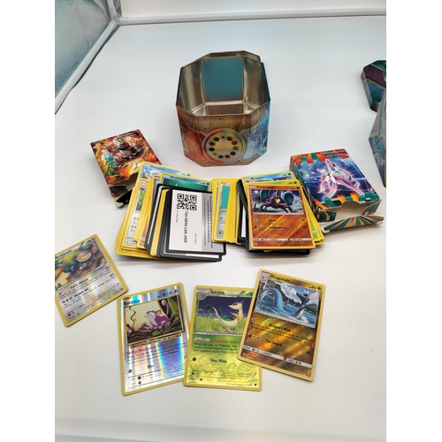 130A - Pokemon Trading Cards in 2 Tins.