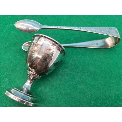 143 - Pair of Silver Sugar Tongs plus Silver Egg Cup. 54 Grams.