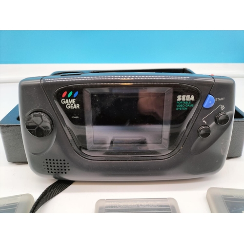 156 - SEGA Game Gear plus Games. Untested. Battery Cover Broken.