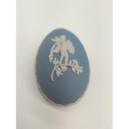 212 - Boxed Wedgwood Jasper Egg Trinket with Cherub Decoration. 5cm High, 7cm x 5cm.