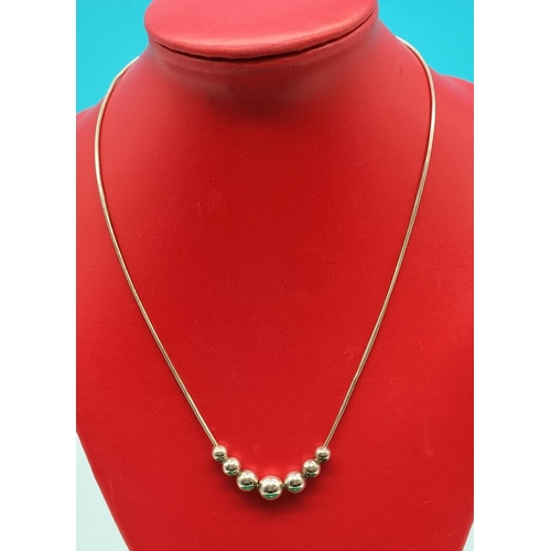 294 - 925 Silver Necklace with Graduated Size Balls on a Snake Chain.