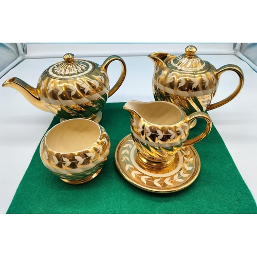 73 - Sadler 'Gold Swirl' Teapot and Stand, Water Pot, Milk and Sugar.