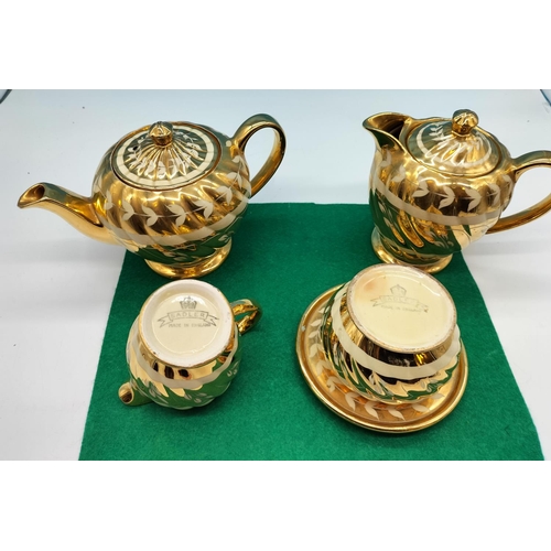 73 - Sadler 'Gold Swirl' Teapot and Stand, Water Pot, Milk and Sugar.