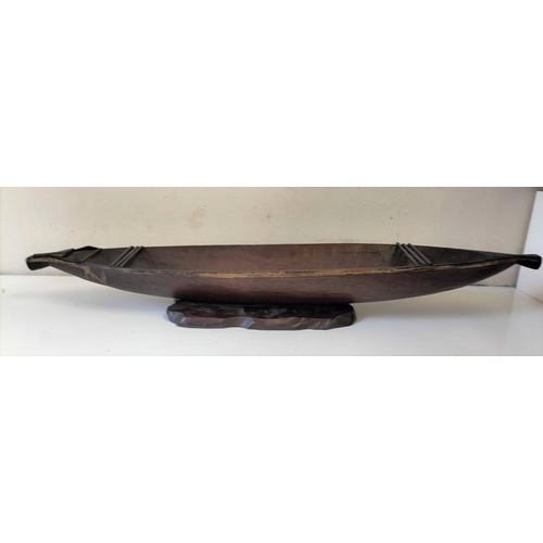 1 - Carved Wooden Native Boat on Stand. 11cm High, 98cm x 18cm.