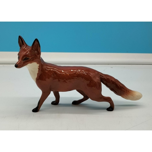 105 - Beswick Model of a Standing Fox. 13cm High, 24cm Long.