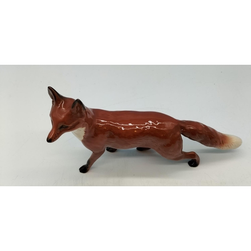 105 - Beswick Model of a Standing Fox. 13cm High, 24cm Long.