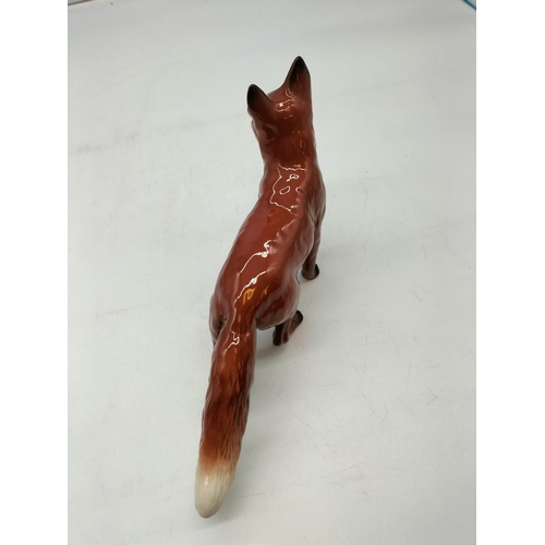 105 - Beswick Model of a Standing Fox. 13cm High, 24cm Long.