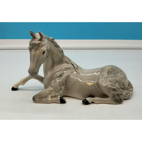 21 - Beswick Figure of a Dapple Grey Lying Down Horse. 13cm High x 26cm.