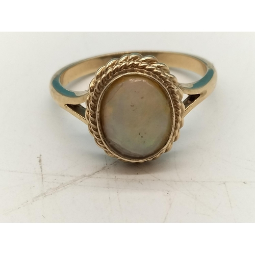 30A - 9ct Gold and Opal Ring. Tested as Gold. Size Q. 3.7 Grams.