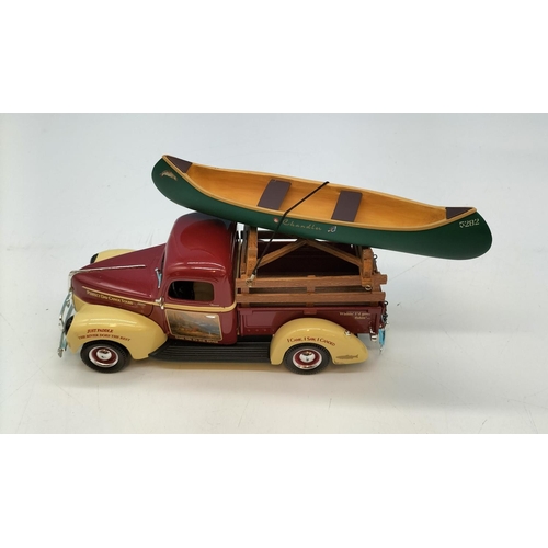 318 - ERTL 1940's Pick Up 'Perfect Days Canoe Tours' with Canoe. Oars A/F. 12cm high x 19cm.