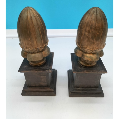 86 - Pair of Wooden Carved Acorns on Plinths. 28cm Tall. Made in India.