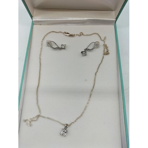 130A - Silver Earring and Necklace Set.