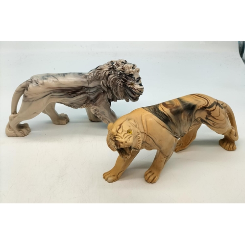 211 - Resin Marble Effect Lion and Lioness Figures. Largest being 23cm x 13cm.